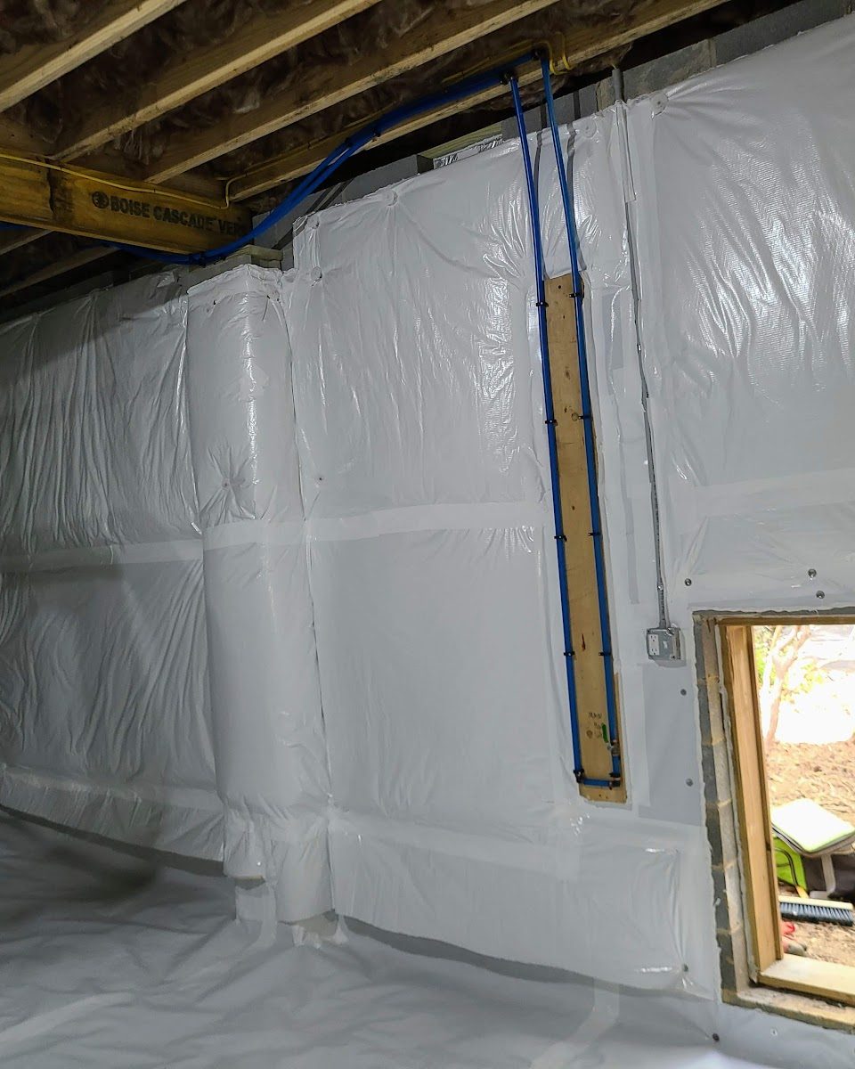 Sealed vapour barrier wall encapsulation with taped seams and access door