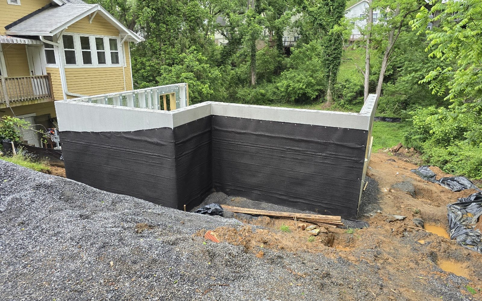 Exterior foundation wall waterproofing membrane applied before backfill, Asheville NC